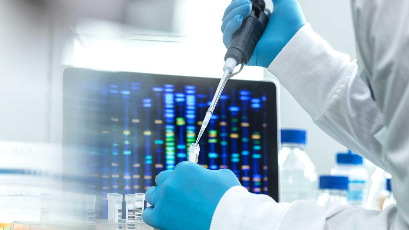 Researcher using a pipette in a lab representing Science Studies at Clarkson Univeristy